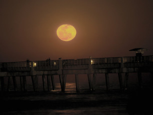 harvest moonrise over Jacksonville Beach pier